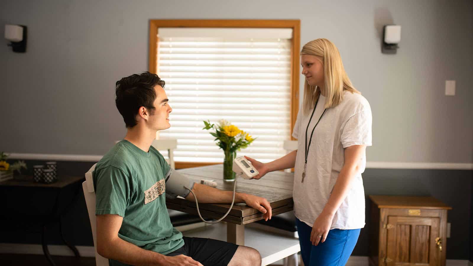 Sandstone Care staff checking teen vital signs during residential treatment