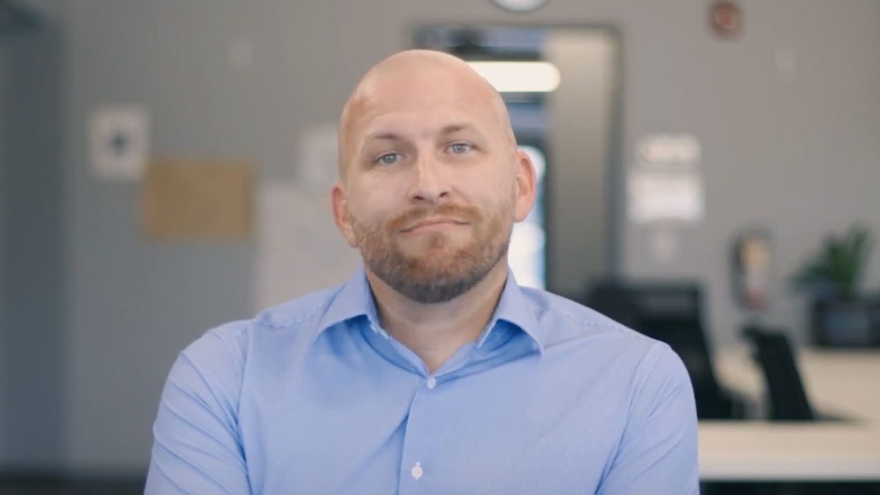 there is a man with a beard and a blue shirt