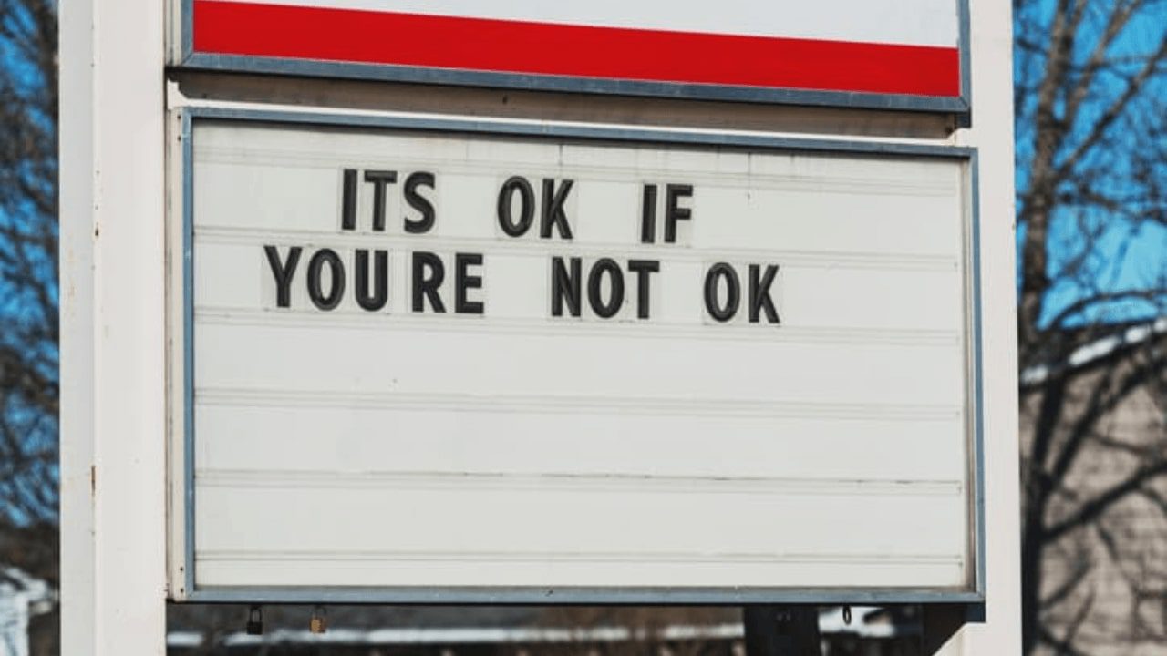 there is a sign that says it ' s ok if you ' re not ok