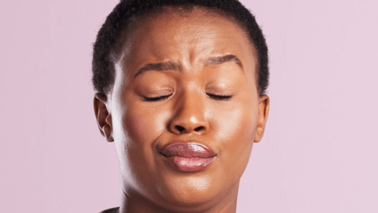 there is a woman with her eyes closed and her eyes closed