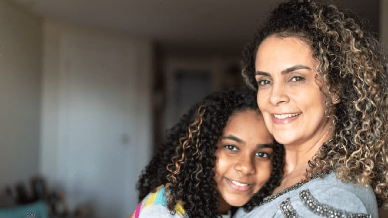 there is a woman and a child that are smiling for the camera