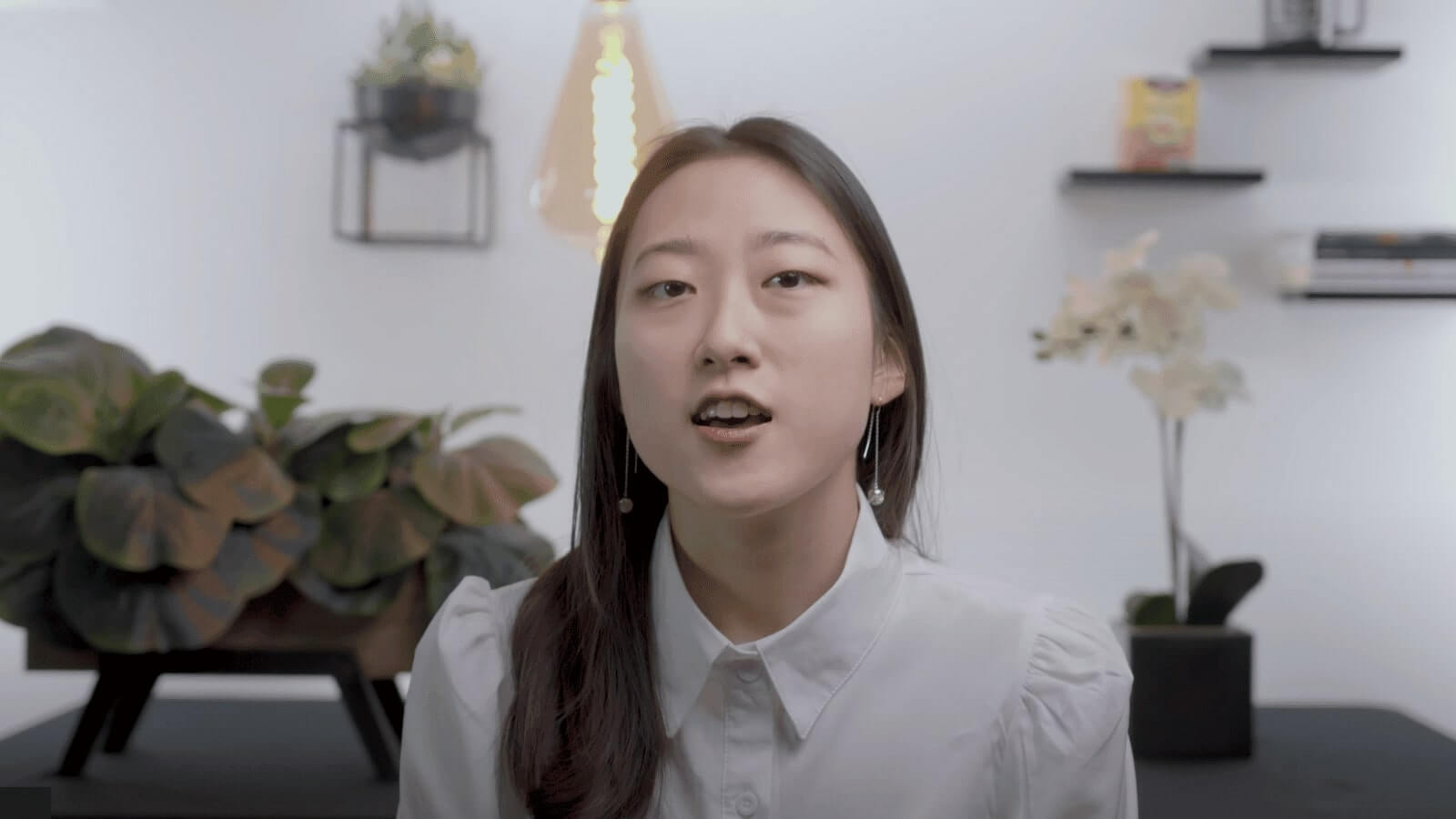 there is a woman that is standing in front of a table