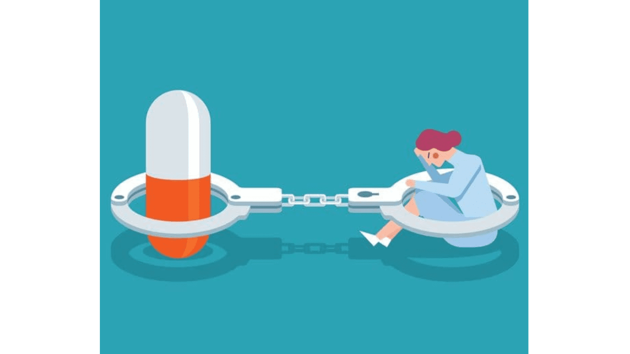 a woman sitting on a boat with a large pill and a chain