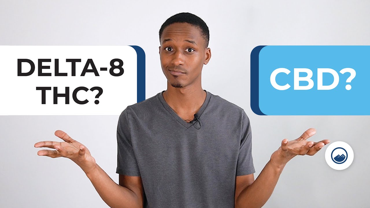 arafed man holding two signs with the words delta and thc