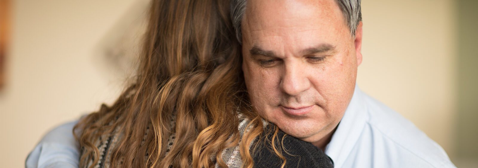 there is a man and a woman that are hugging each other