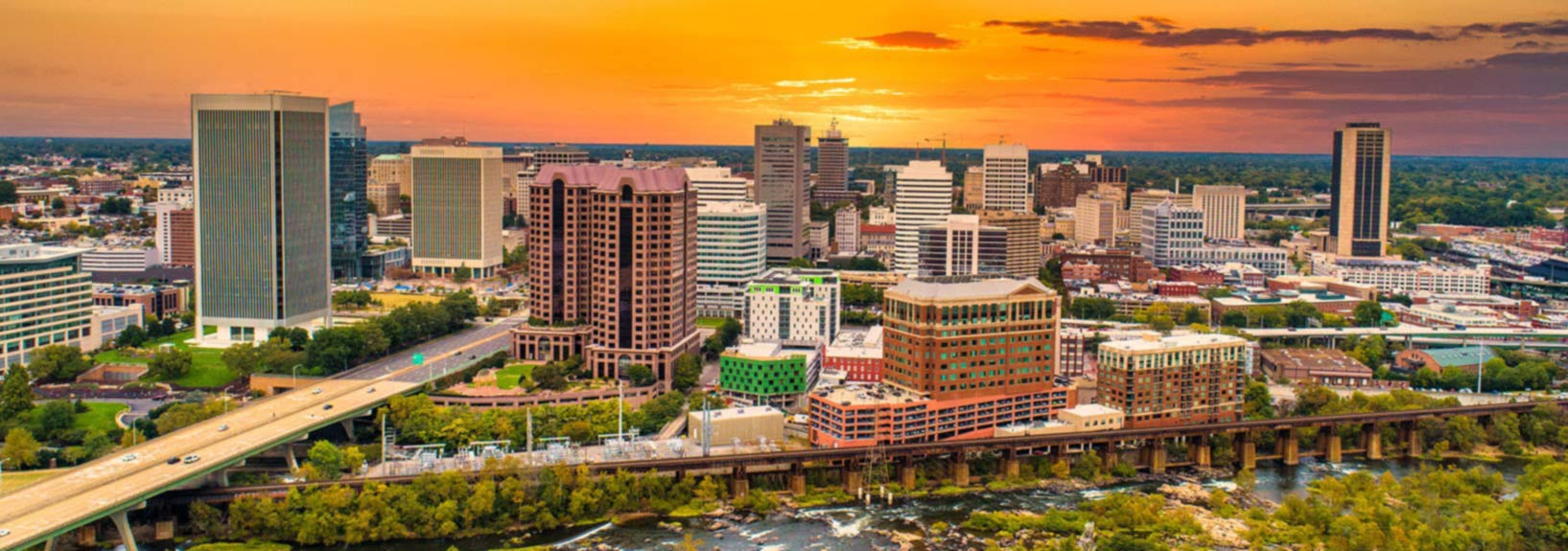 a view of a city with a bridge and a river