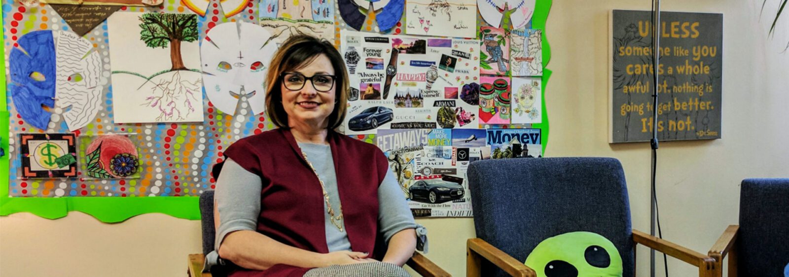 there is a woman sitting in a chair in a room