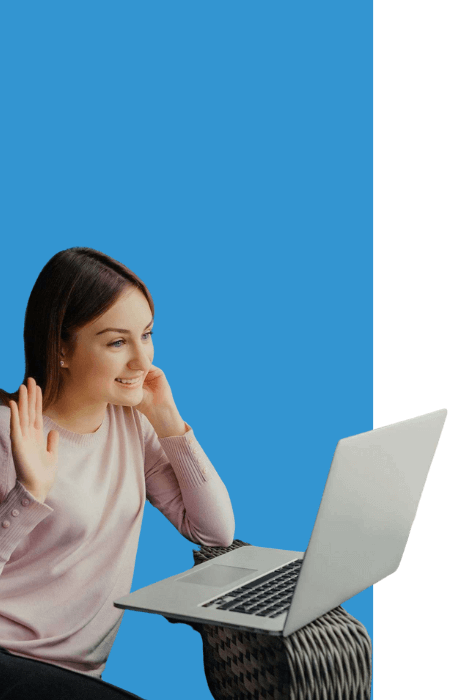 there is a woman sitting on a chair with a laptop