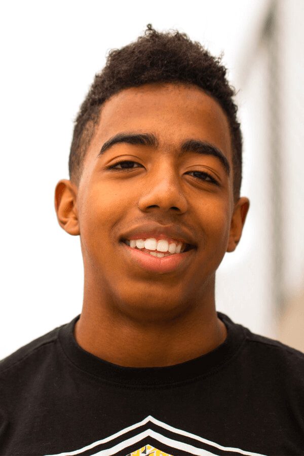 arafed young man with a black shirt and a white shirt