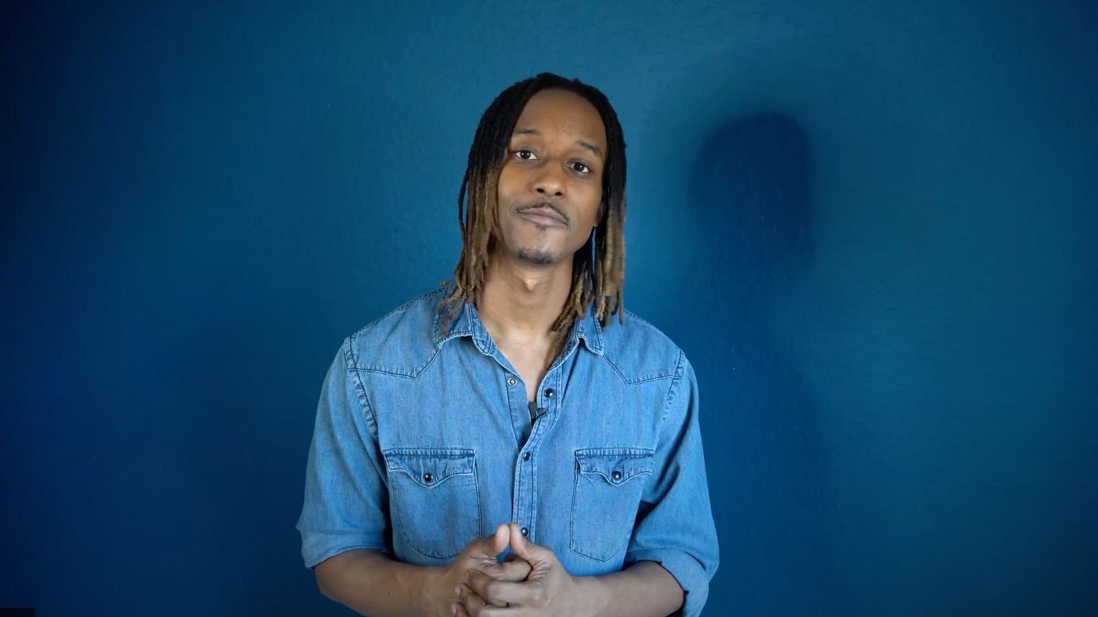 African American holding hands on a dark navy background