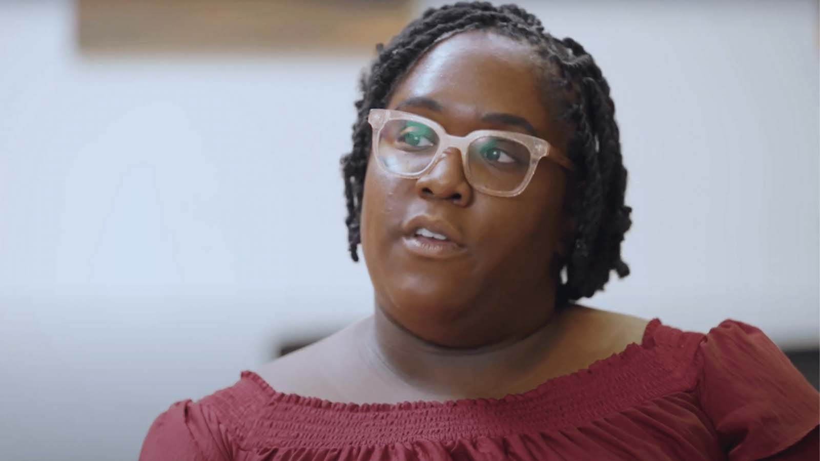 there is a woman with glasses on looking at the camera