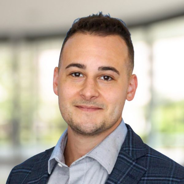 a close up of a man in a suit jacket and a shirt